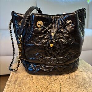 CHANEL Black Quilted Lambskin Drawstring Shoulder Bag with Gold Hardware